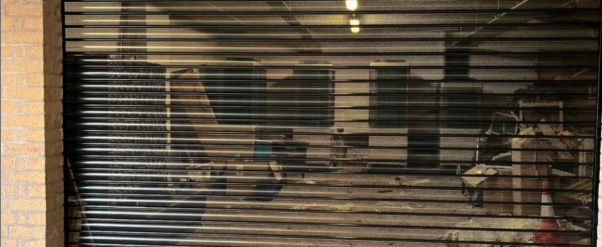 Powder coated and perforated electric roller shutter door fitted at Redwing Lodge